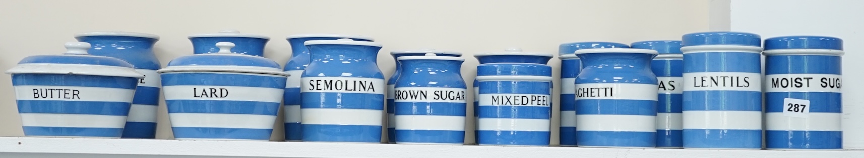 T.G.Green Cornish Kitchenware, fifteen lidded storage jars, to include Moist Sugar, Spaghetti, Semolina, Patna Rice, Brown Rice, Butter and Lard, largest 14cm high, Black Shield marks. Condition - poor, fair and good